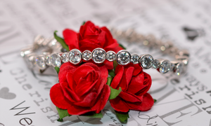 Diamond Bracelet Over Red Roses 