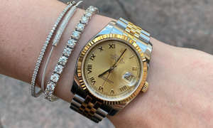 A Rolex Layered with Diamond Bracelets